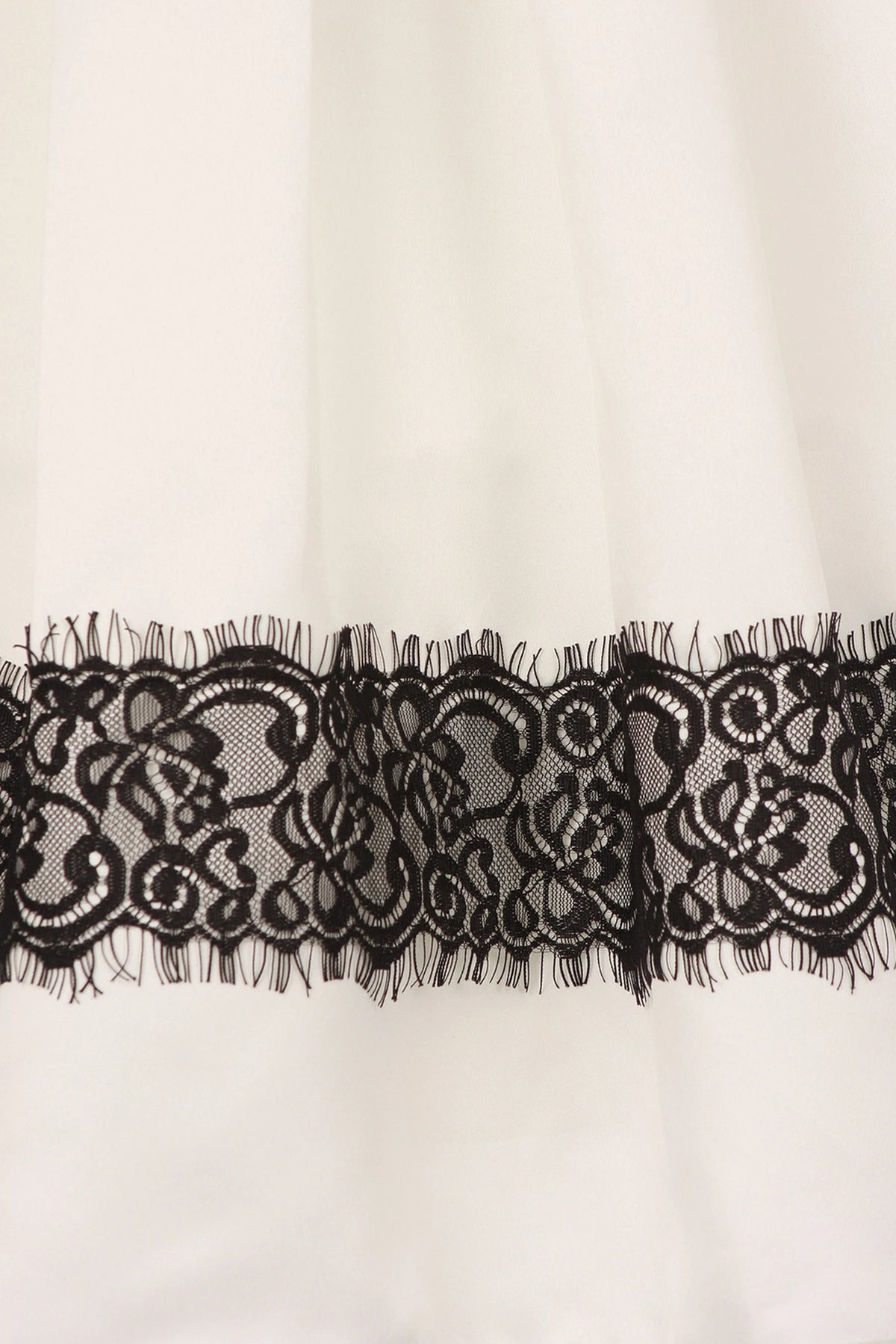 Featuring black floral lace band along the hem on the Ivory flower girl dress.