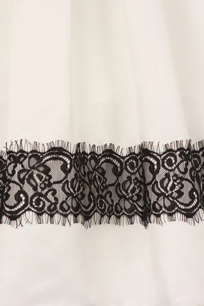 Featuring black floral lace band along the hem on the Ivory flower girl dress.