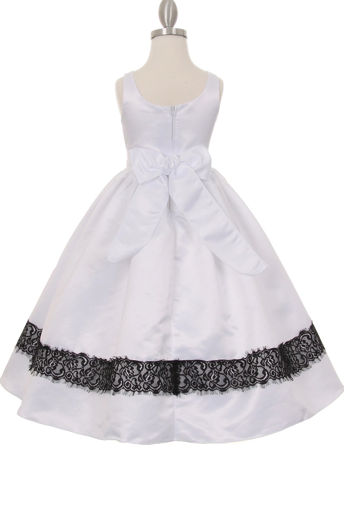 A White flower girl dress showing large back sash bow above the pleated skirt.