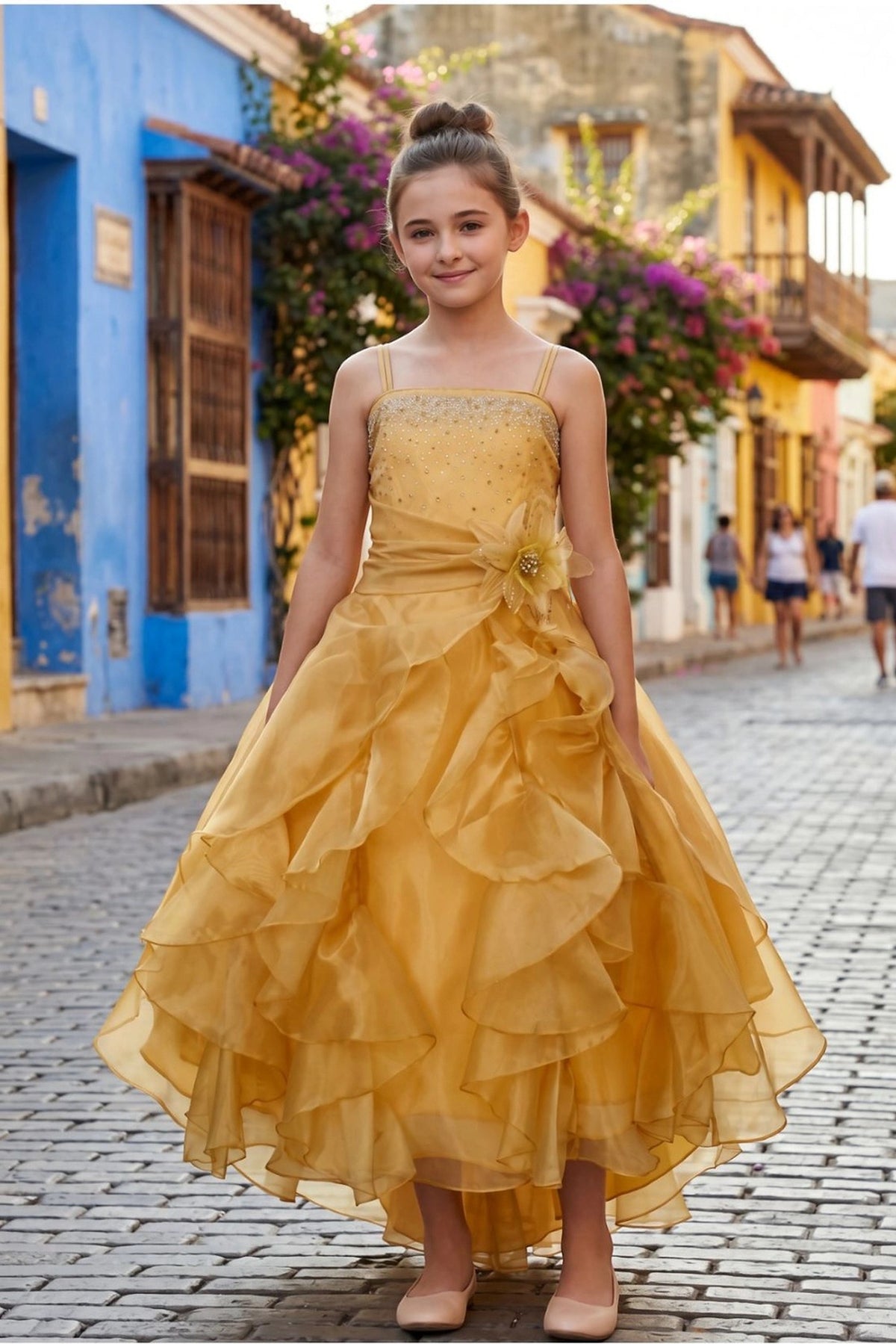 Gold mini quince dress with tiered organza ruffles and thin shoulder straps.