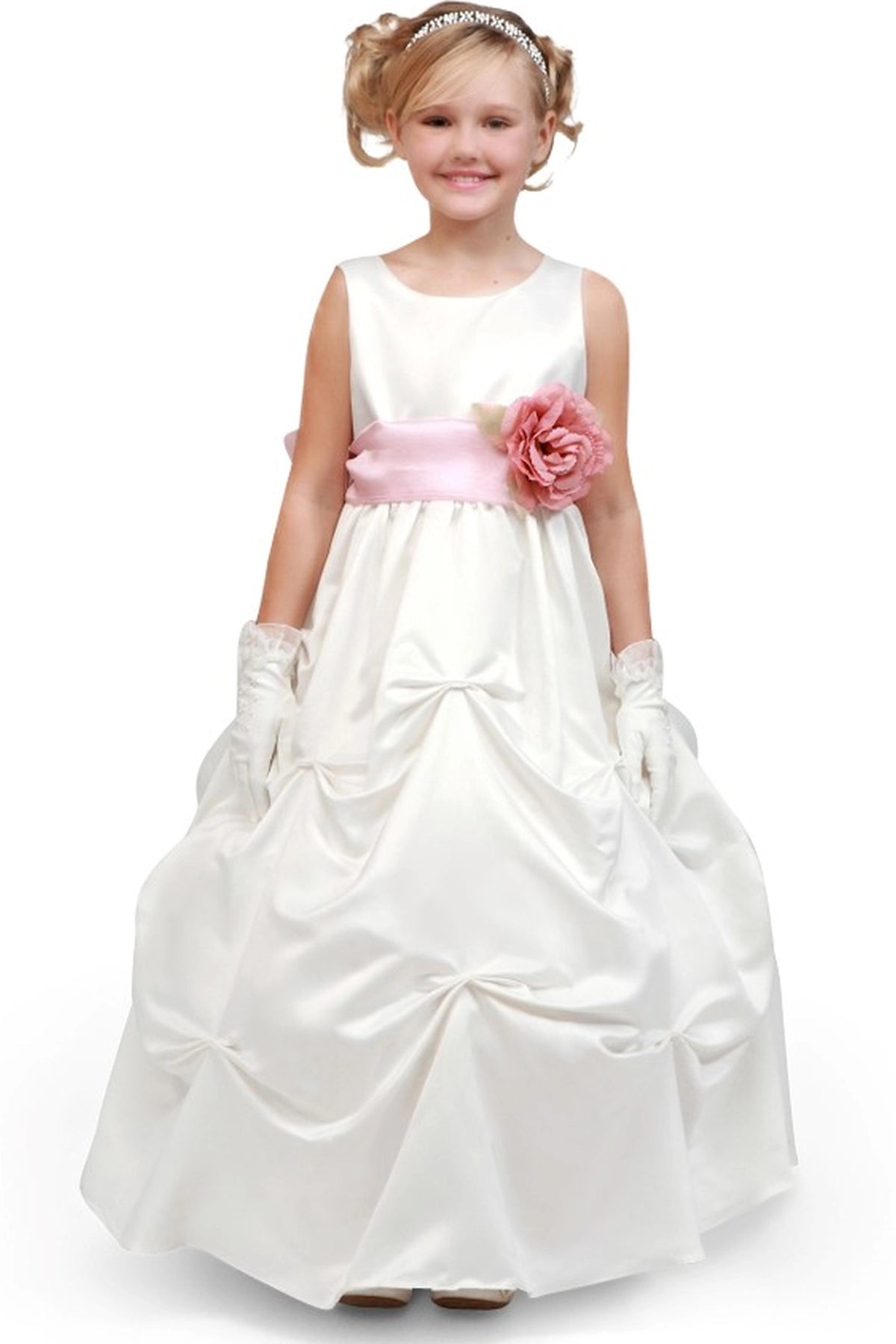 Ivory flower girl dress features pink flower at the waist above a pick-up skirt.