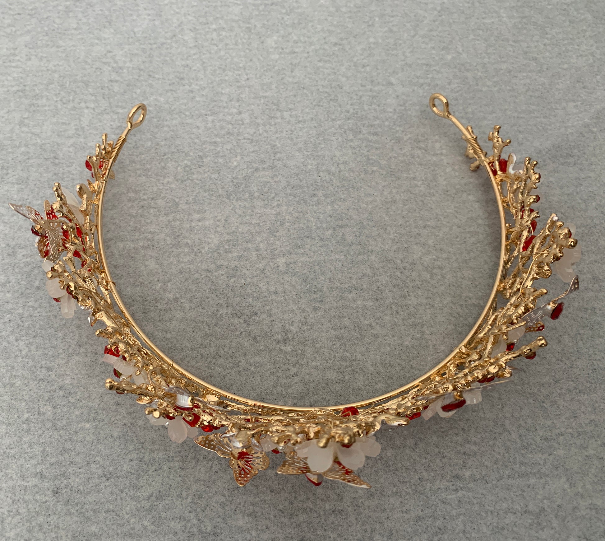 Red gold butterfly floral quinceañera tiara, top view.