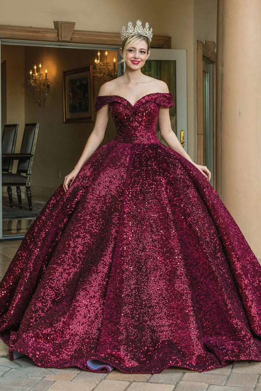 Front view of a Fuchsia quinceañera gown with off-the-shoulder neckline, heart-shaped bodice, and crystal accents