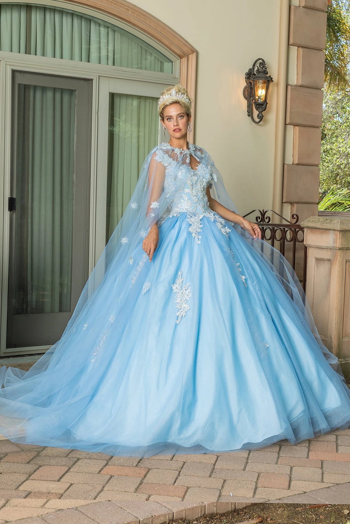 From the front, the Bahama Blue quinceañera ball gown reveals its floor-length skirt.