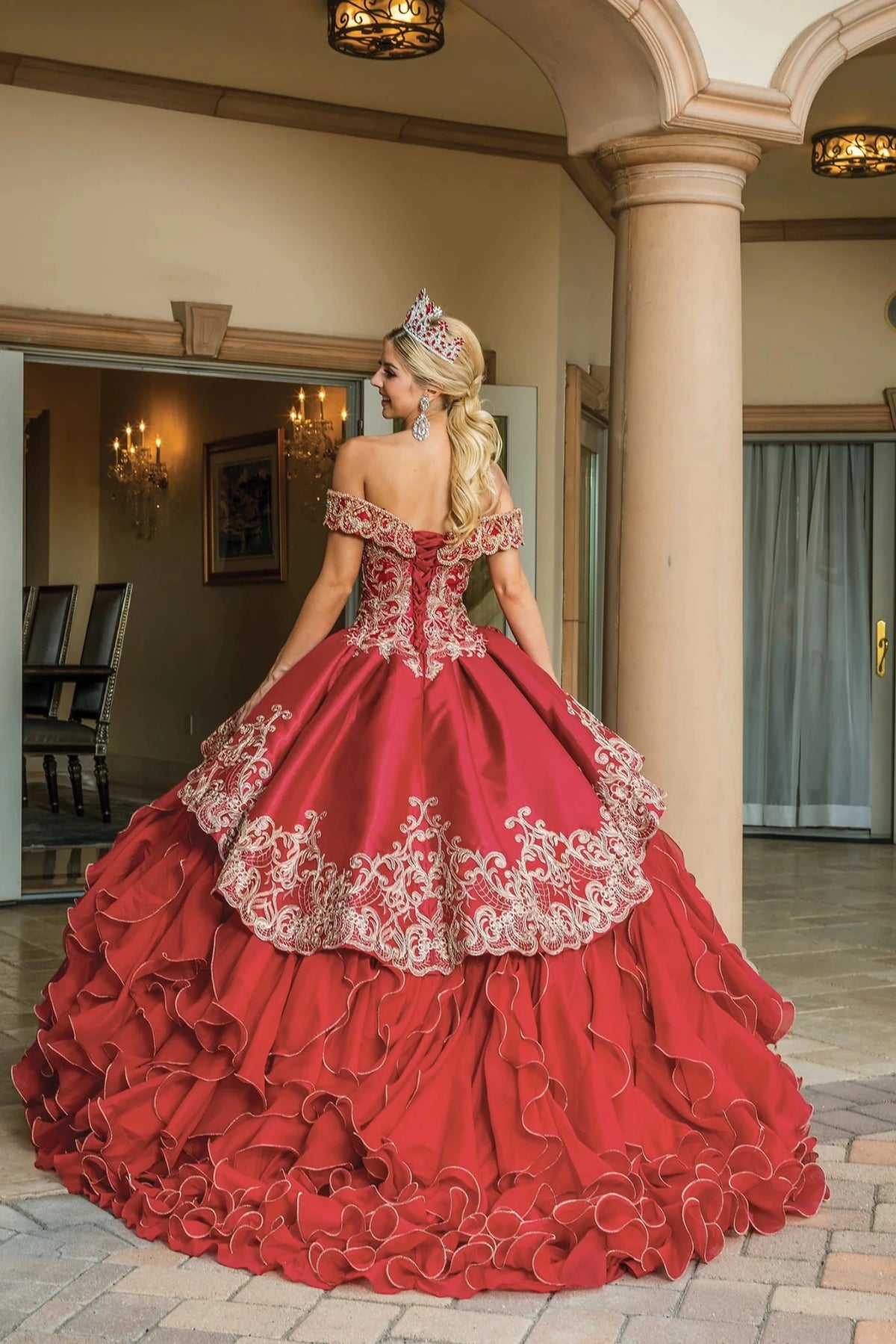 Alternate full-length view of a Burgundy quinceañera gown highlighting cascading ruffle skirt, beaded embroidery, and off-the-shoulder neckline