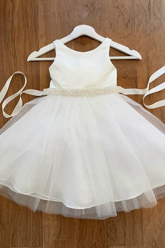 Off white sleeveless flower girl dress with a ivory pearl sash 
