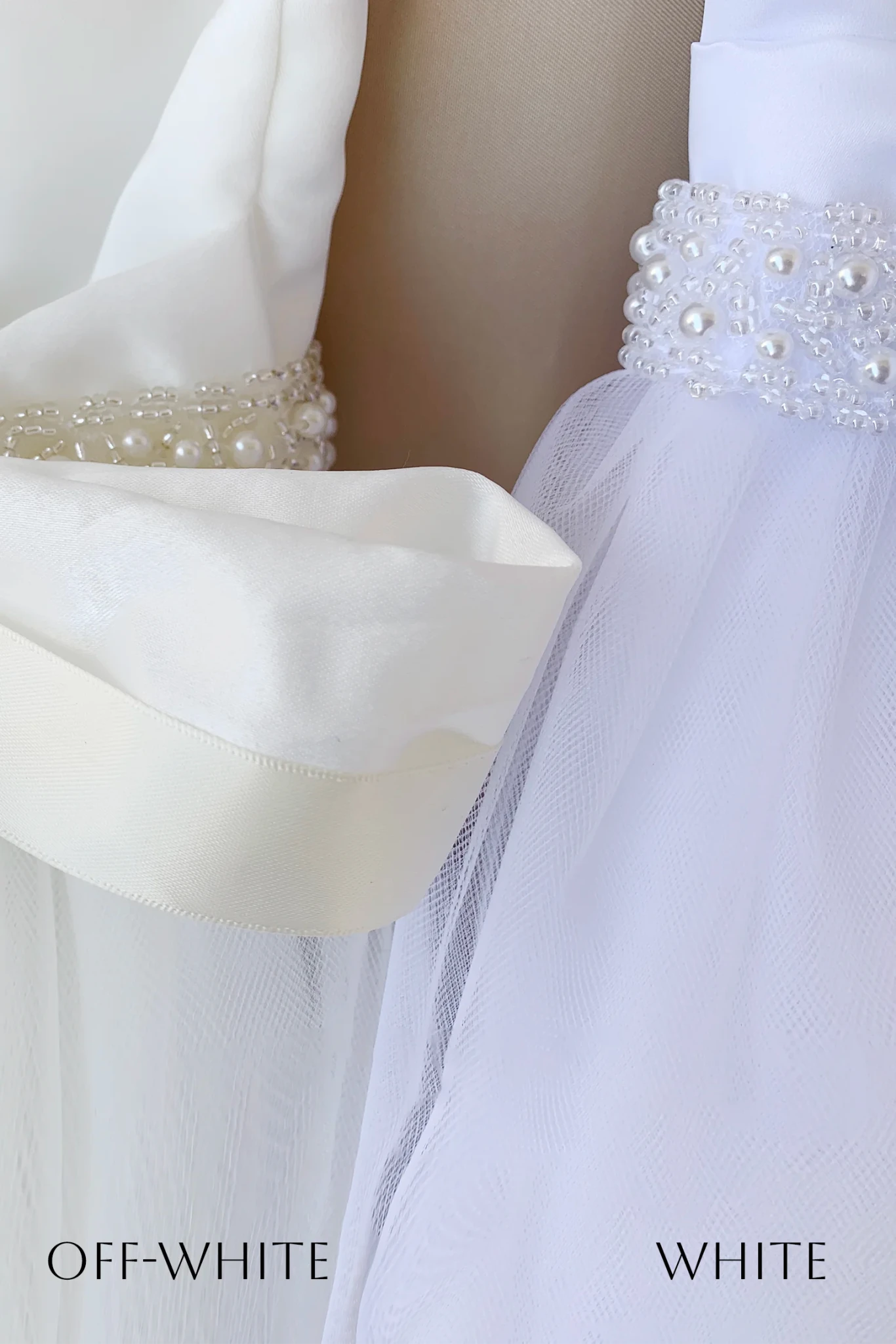 Close-up of a white or off-white tulle dress or gown with a pearl-beaded waistband, Text at the bottom reads OFF-WHITE and WHITE.