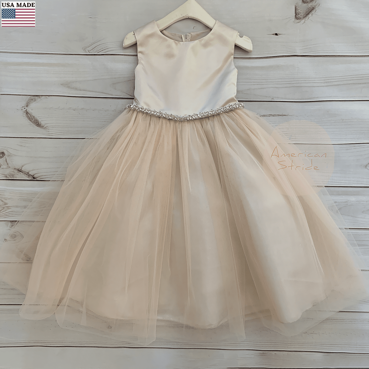 Champagne rose flower girl tulle flower girl dress with clear rhinestone embellishment.