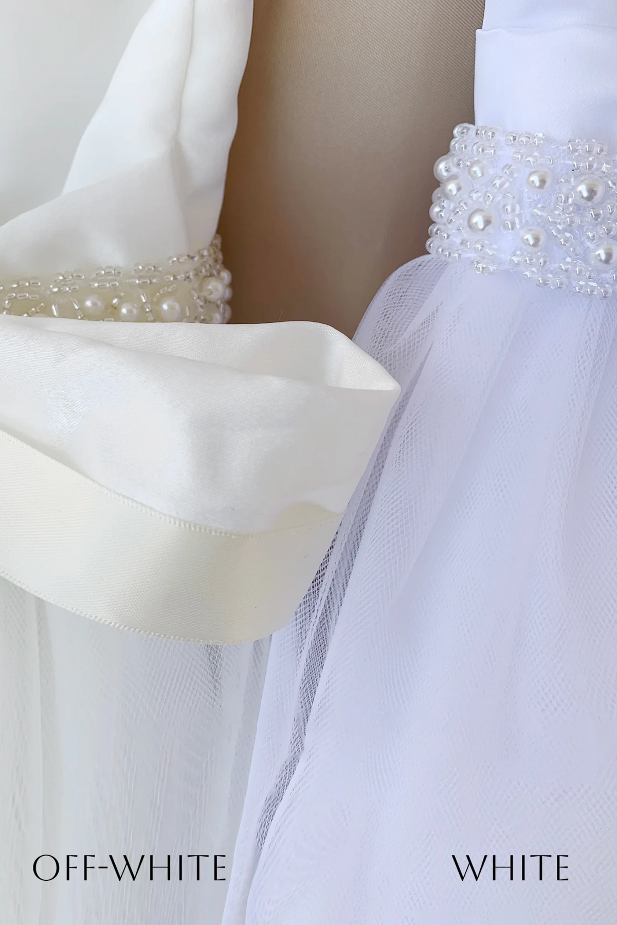 Textured details appear across white or off-white tulle flower girl dress or gown with a pearl-beaded waistband.