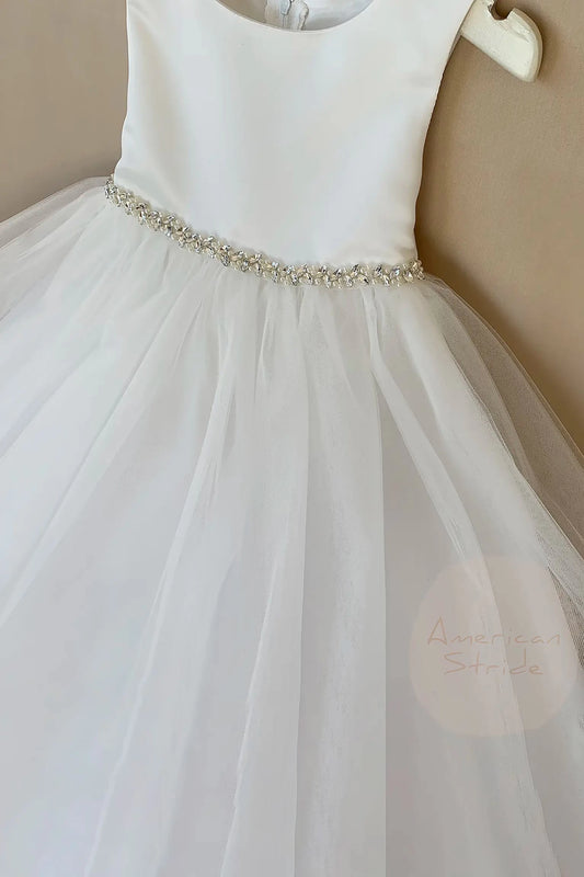 White flower girl dress with a beaded waistband.Tthe top is satin, and the skirt has 4 layer of tulles.