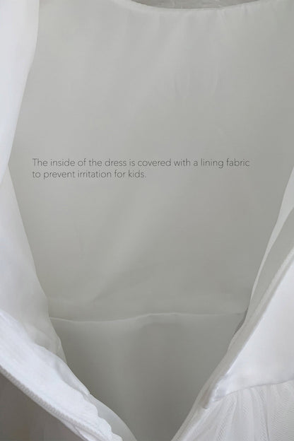 Bodice close-up highlights flower girl dress with smooth white interior lining inside the communion flower girl dress.