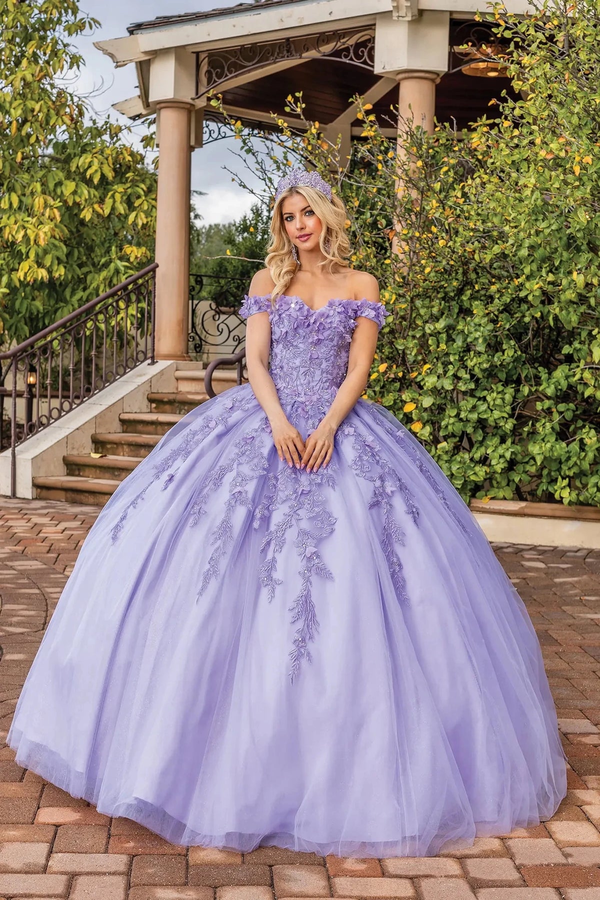 Front view of a Lilac quinceañera gown with off-the-shoulder neckline and lace appliqués