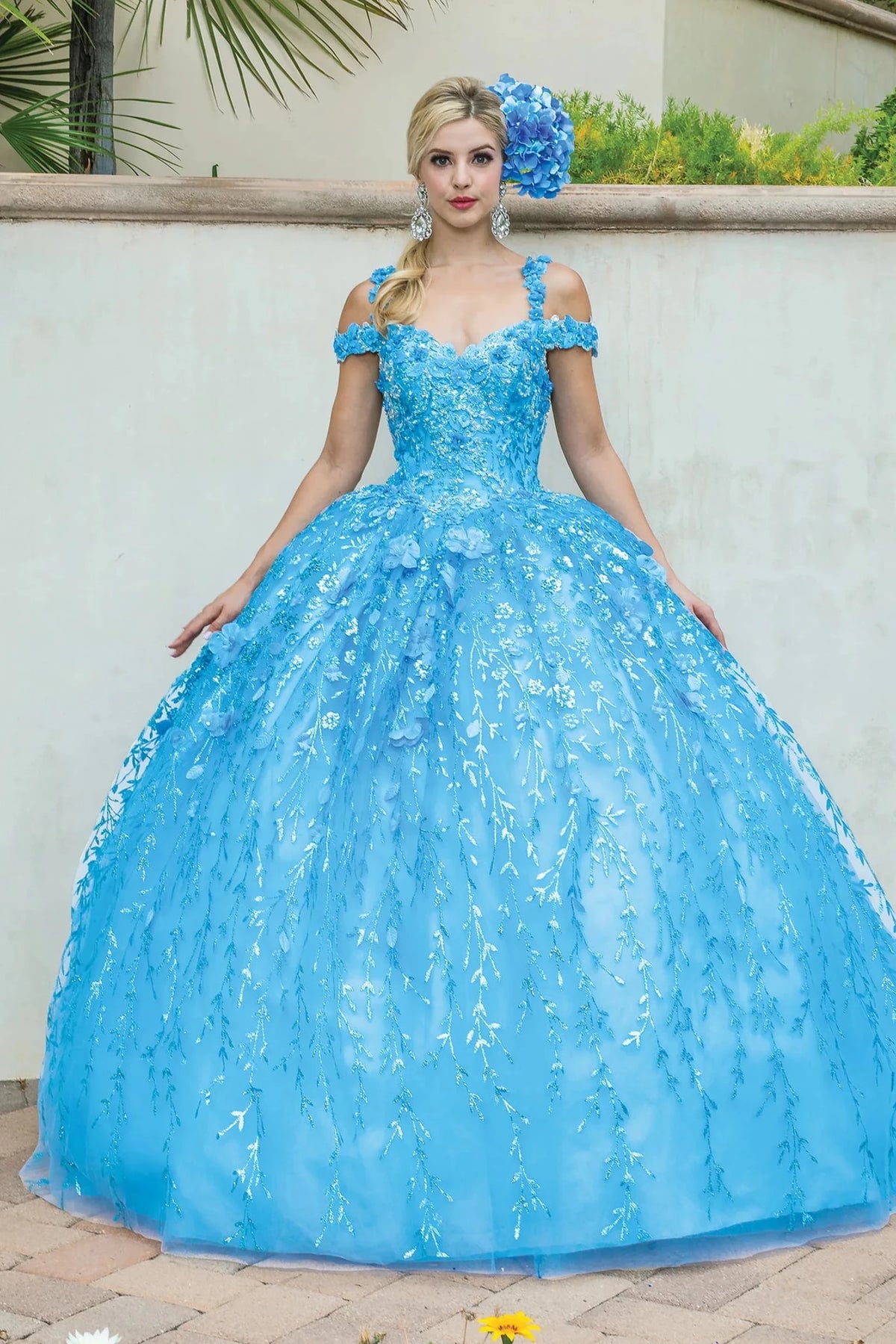 Front view of a Bahama Blue quinceañera gown with off-the-shoulder neckline, floral appliqués, and embroidered tulle skirt