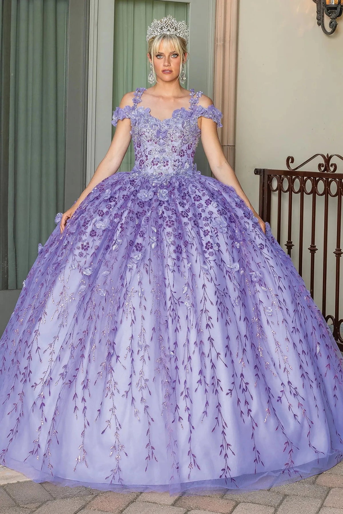 Front view of a Lilac quinceañera gown with off-the-shoulder neckline, floral appliqués, and embroidered tulle skirt