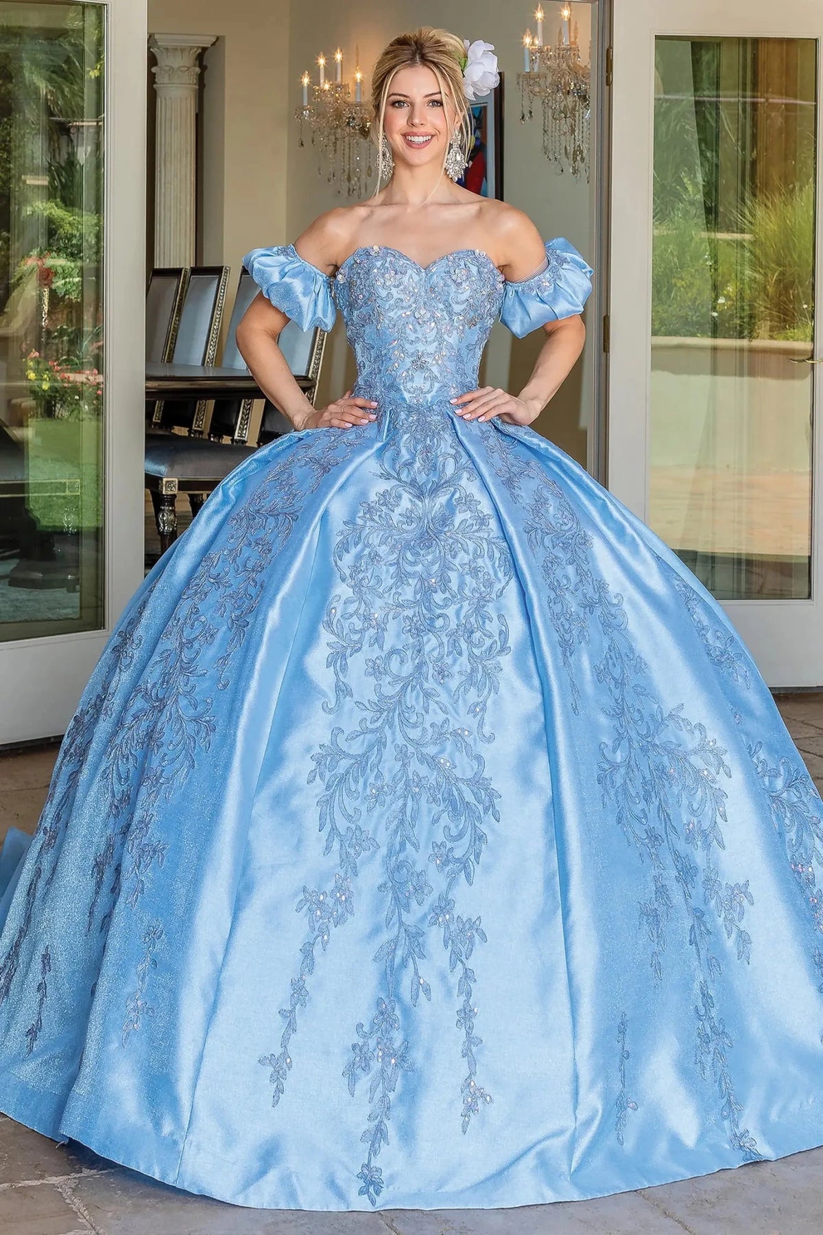 Front view of a Bahama Blue quinceañera gown with embroidered lace