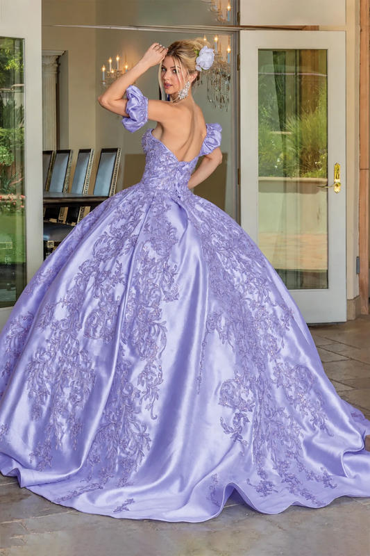 lilac quince ball gown with intricate lace applique and puff sleeves