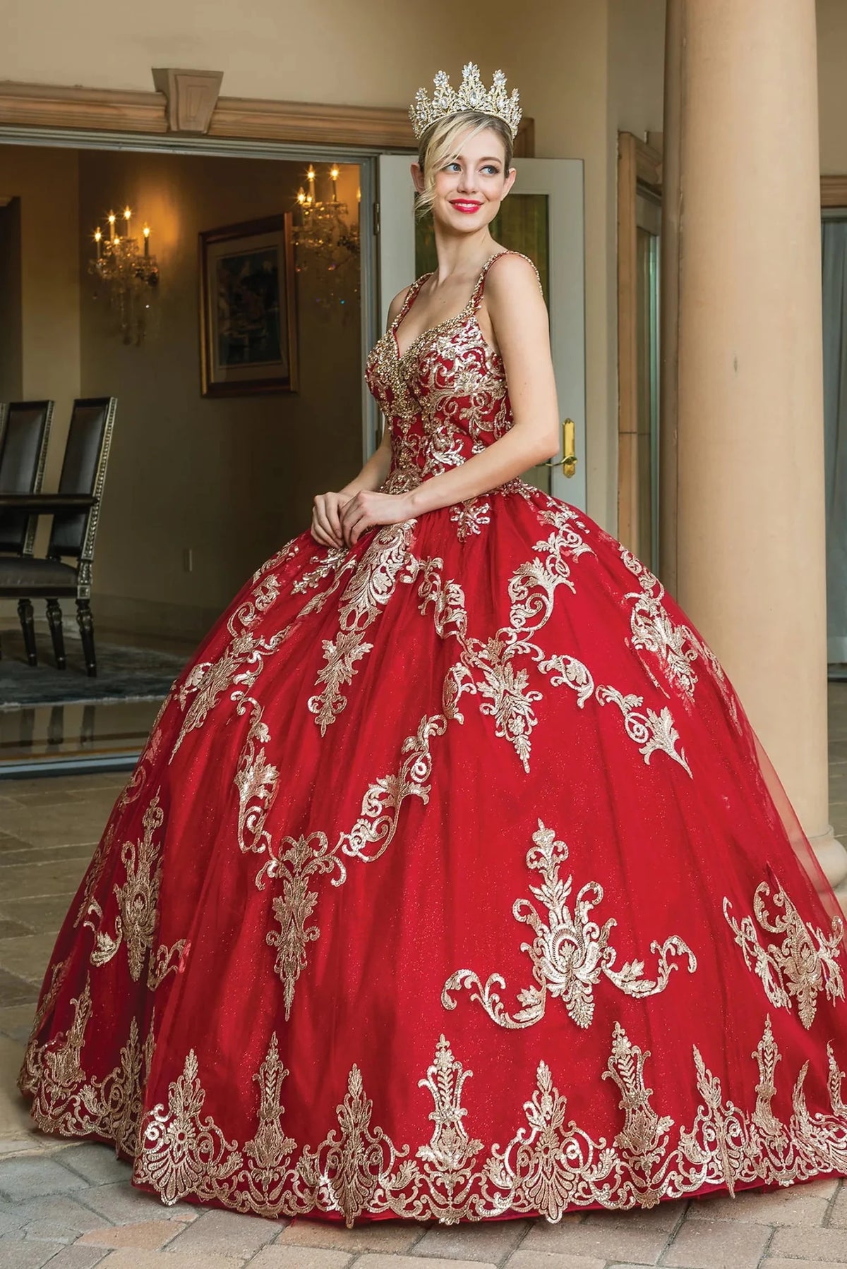 Front view of a Burgundy quinceañera gown with embroidered bodice and crystal accents