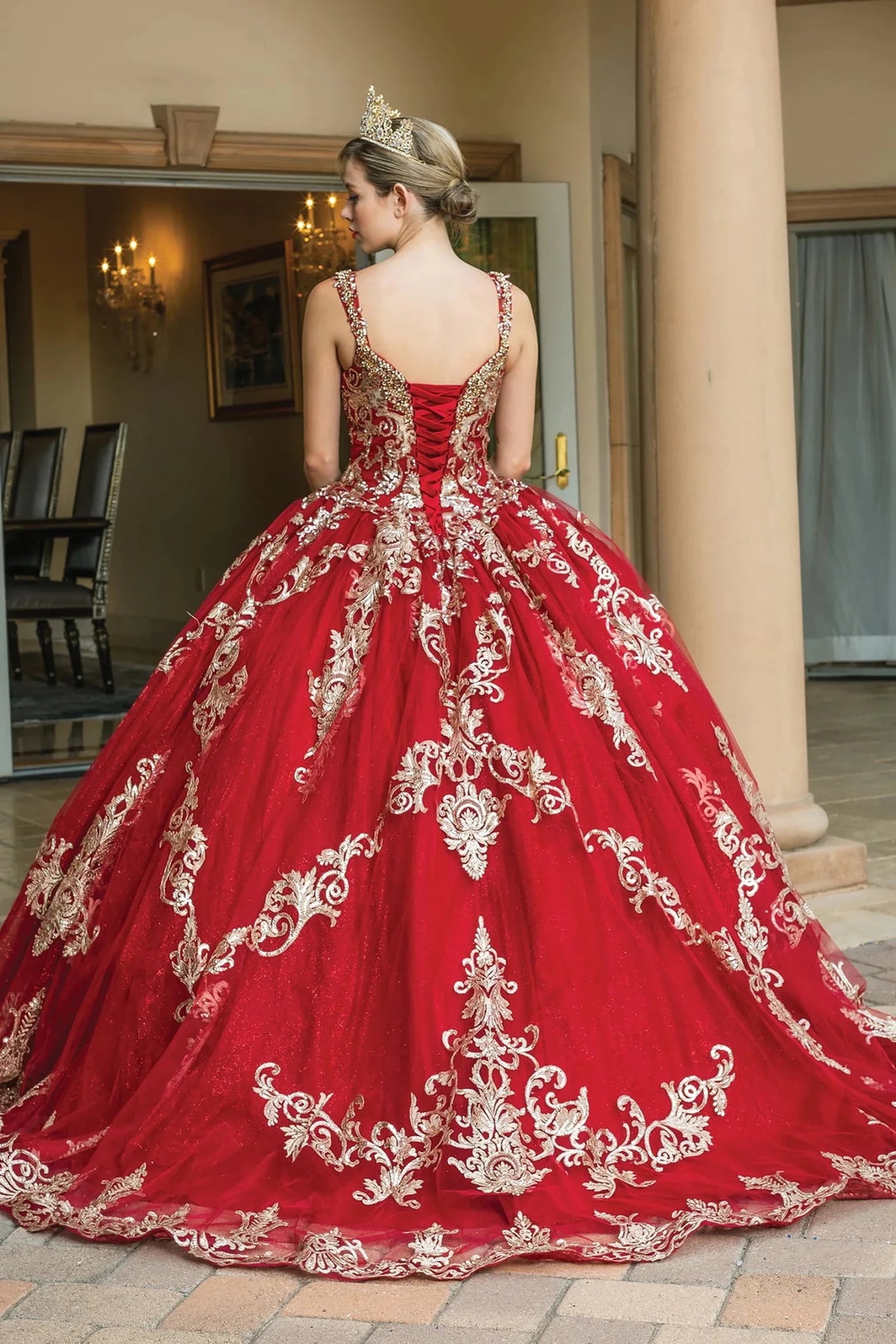 Back view of a Burgundy quinceañera gown showing lace-up back and crystal accents