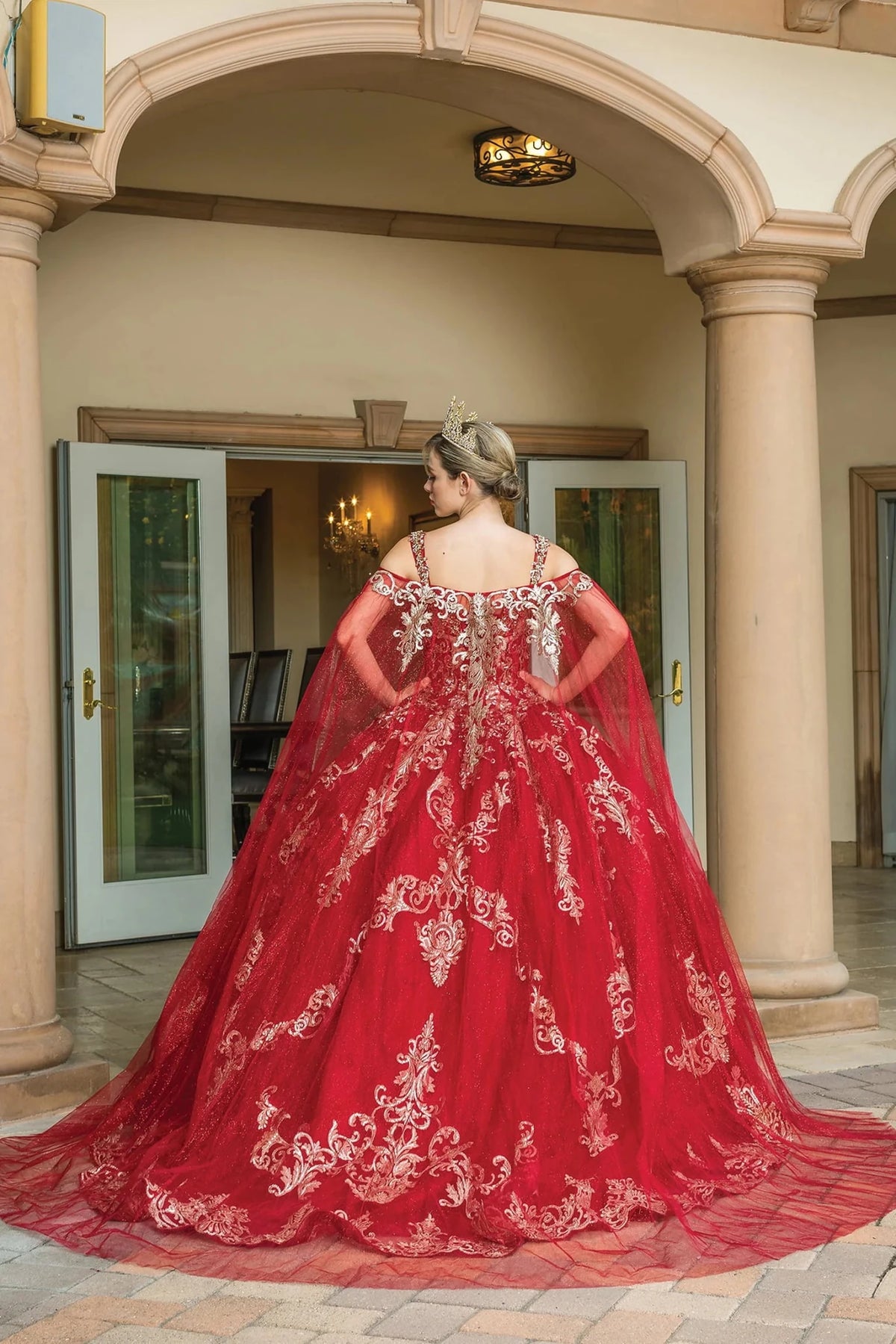 Alternate full-length view of a Burgundy quinceañera gown highlighting crystal accents