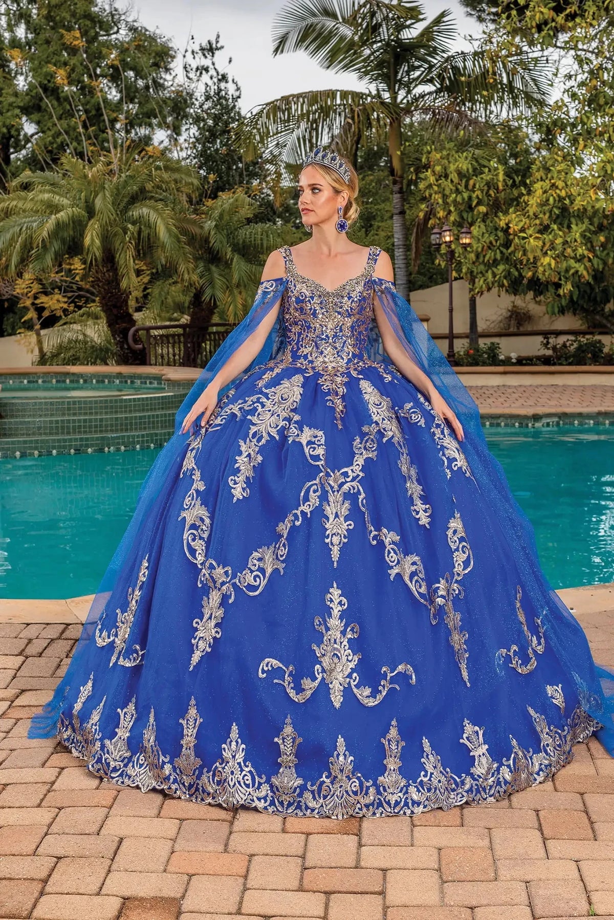 Front view of a Royal Blue quinceañera gown with embroidered bodice and crystal accents