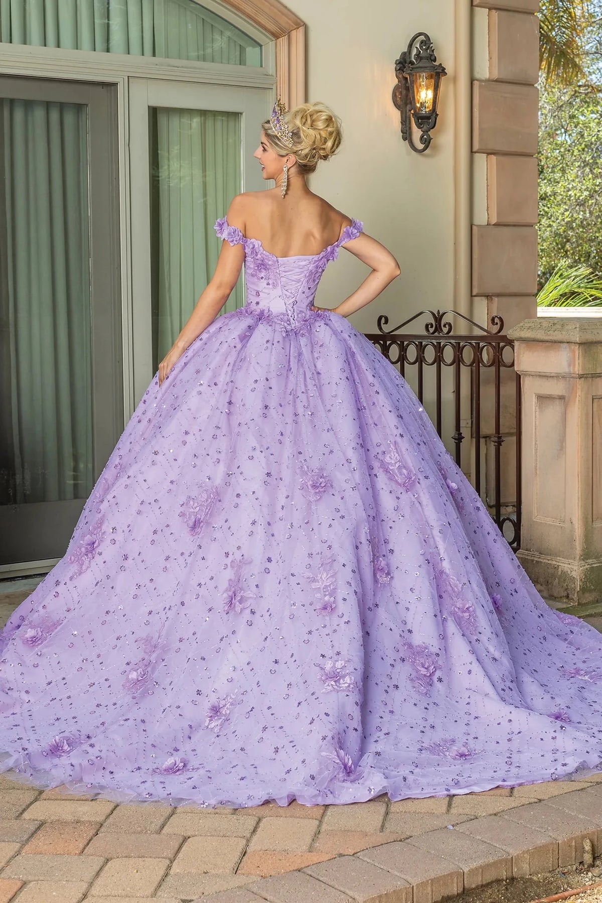 Rear view of a Lilac quinceañera gown showing lace-up back and floral embroidery