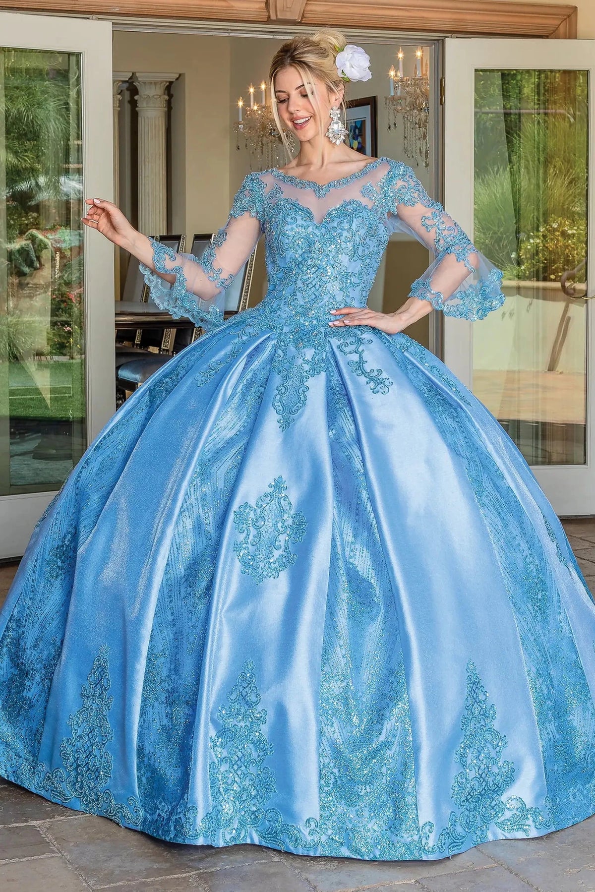 Front view of a Bahama Blue quinceañera gown with off-the-shoulder neckline, embroidered lace, and glitter tulle skirt