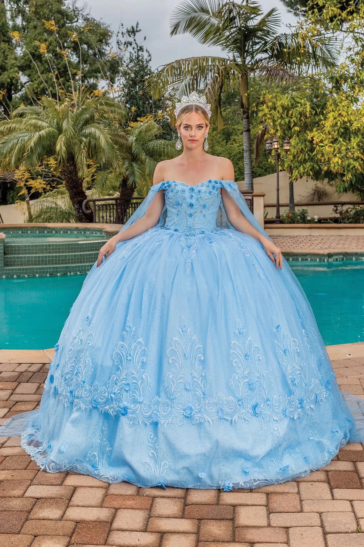 Full-length front view of a Bahama Blue quinceañera gown with off-the-shoulder neckline and floral embroidery