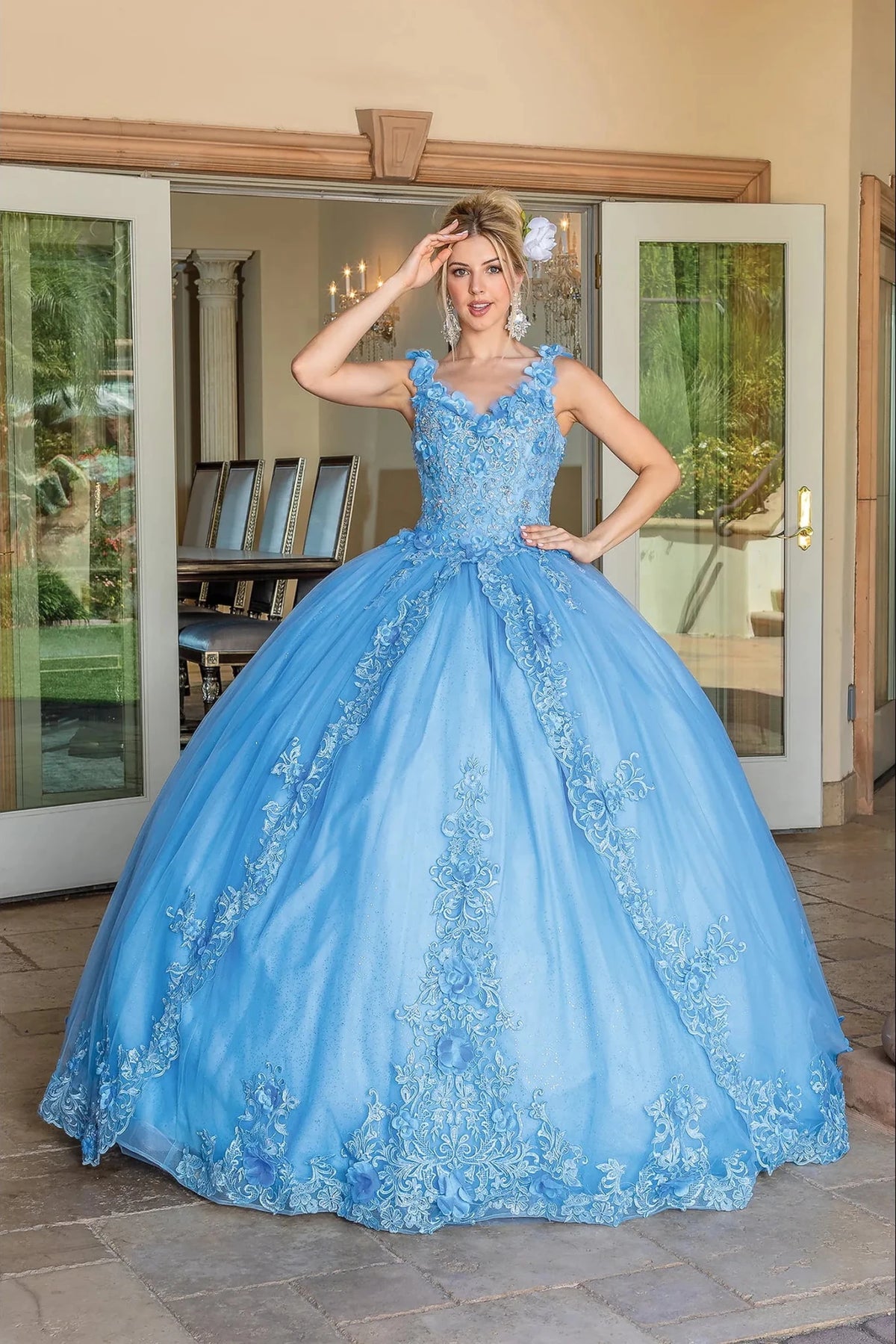 Front view of a Bahama Blue quinceañera gown with beaded bodice, embroidered lace, and voluminous full skirt