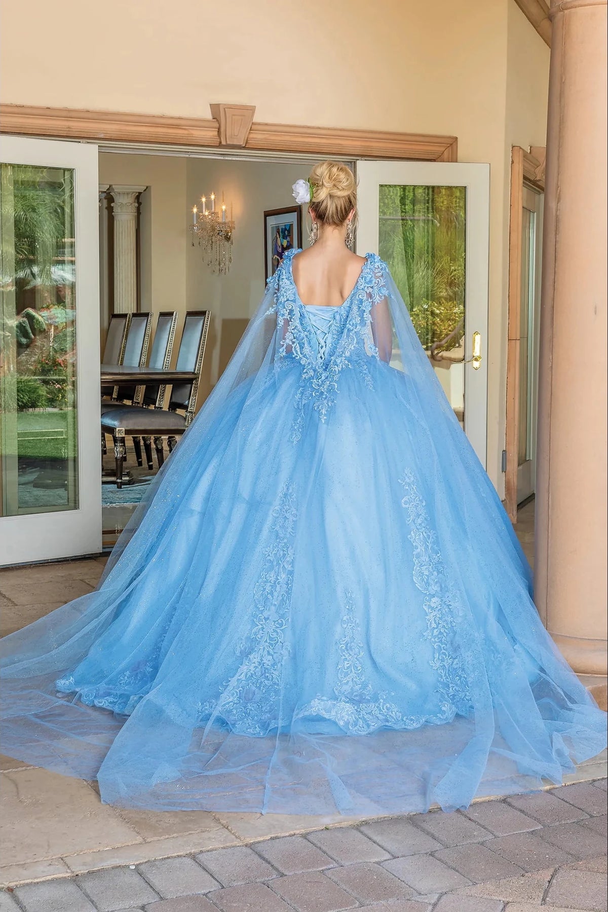 Second alternate full-length view of a Bahama Blue quinceañera gown highlighting voluminous full skirt and embroidered lace