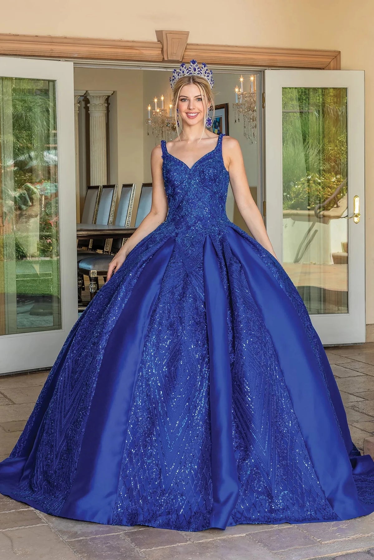 Additional full-length view of a Royal Blue quinceañera gown highlighting voluminous full skirt, lace appliqués, and V-neckline