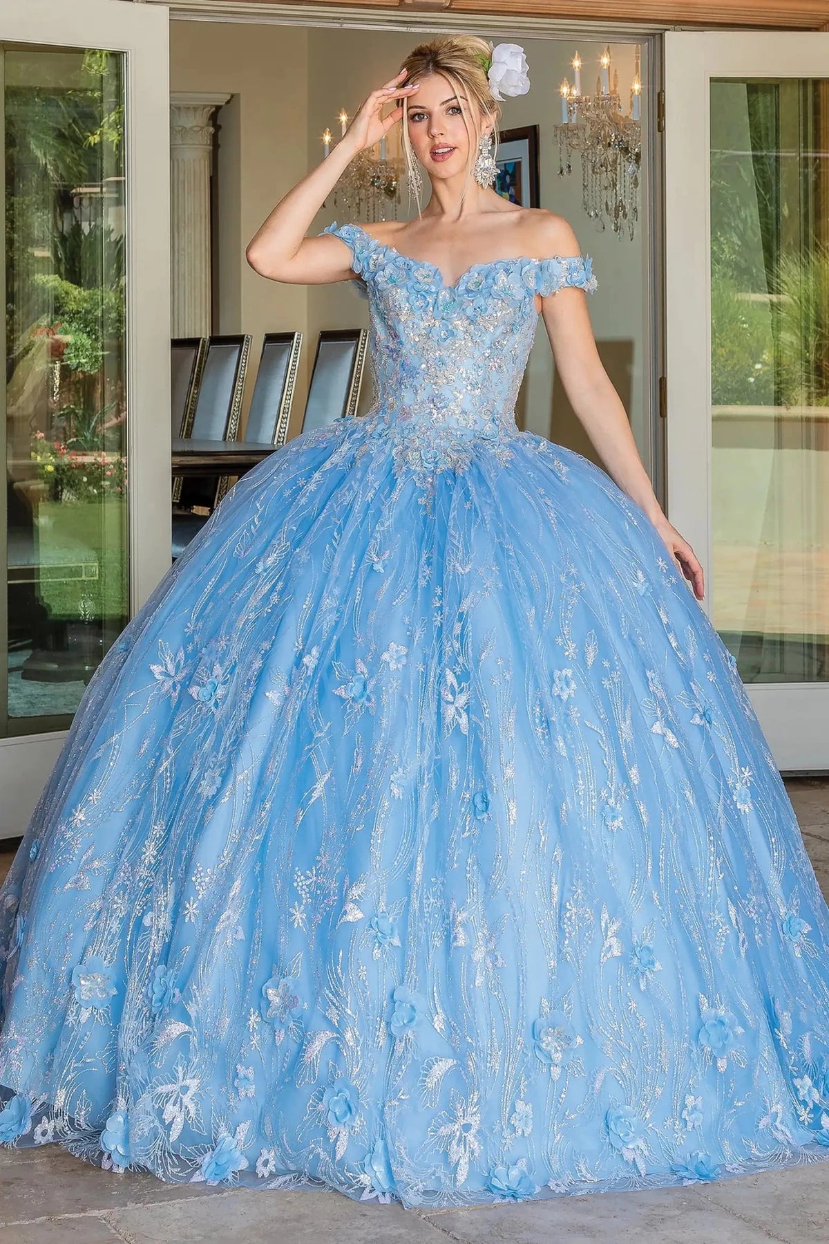 Front view of a Bahama Blue quinceañera gown with off-the-shoulder neckline, embellished bodice, and glitter tulle skirt