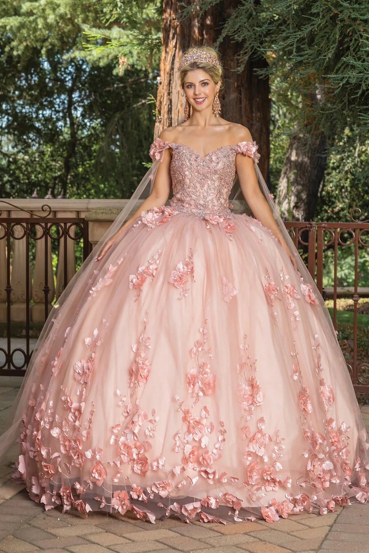 Front view of a Rose Gold quinceañera gown with cap sleeves and floral appliqués