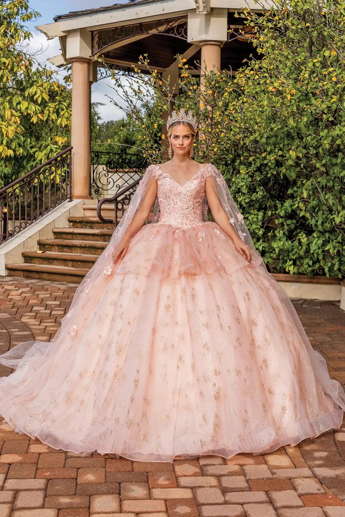 Front view of a Rose Gold quinceañera gown with floral appliqués