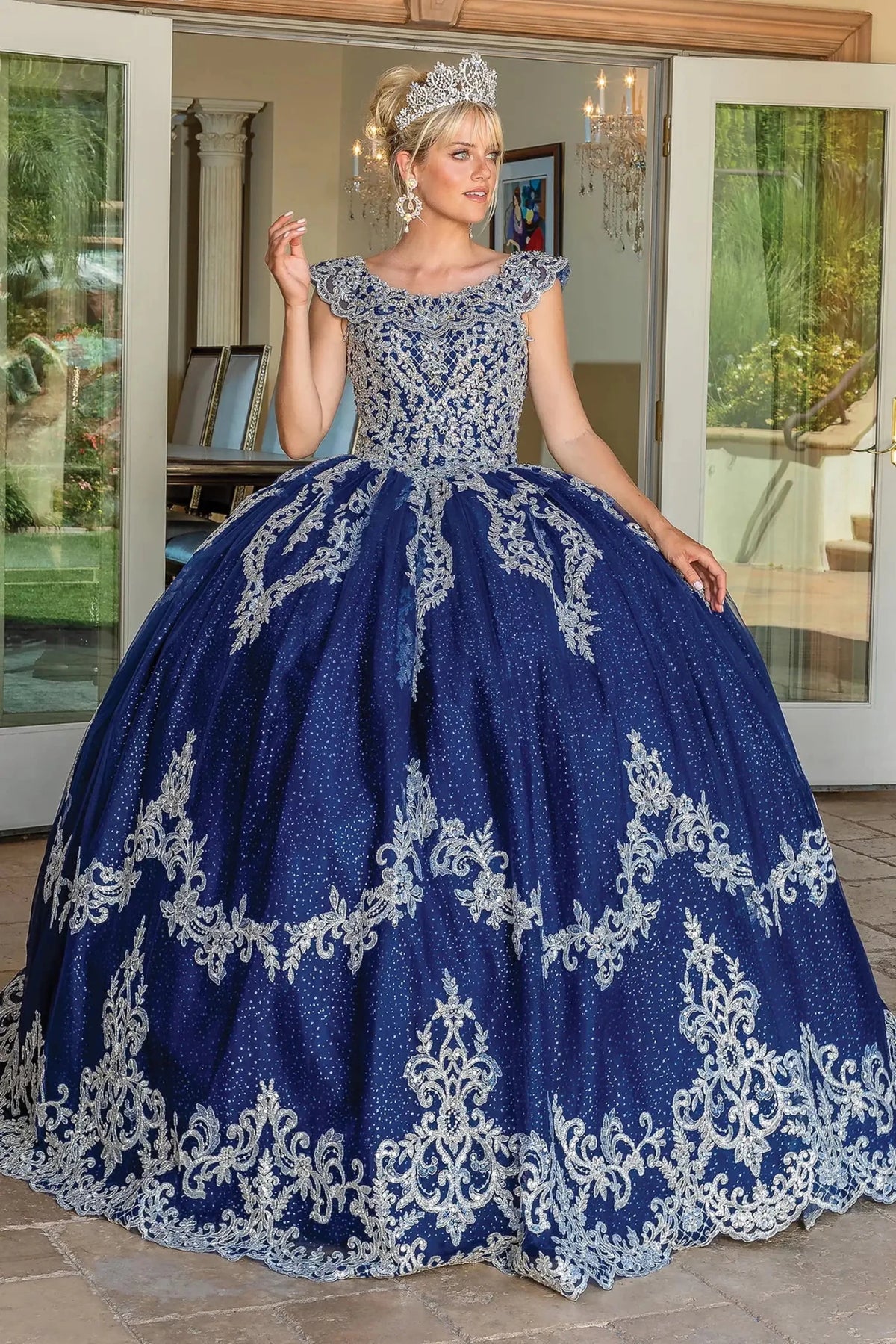 Front view of a Navy quinceañera gown with cap sleeves and beaded bodice