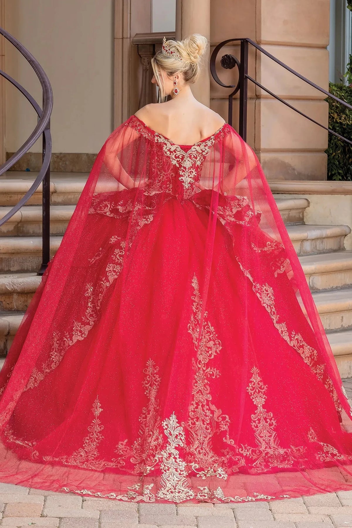 Back view of a Burgundy quinceañera gown showing lace-up back, matching stole, and voluminous full skirt