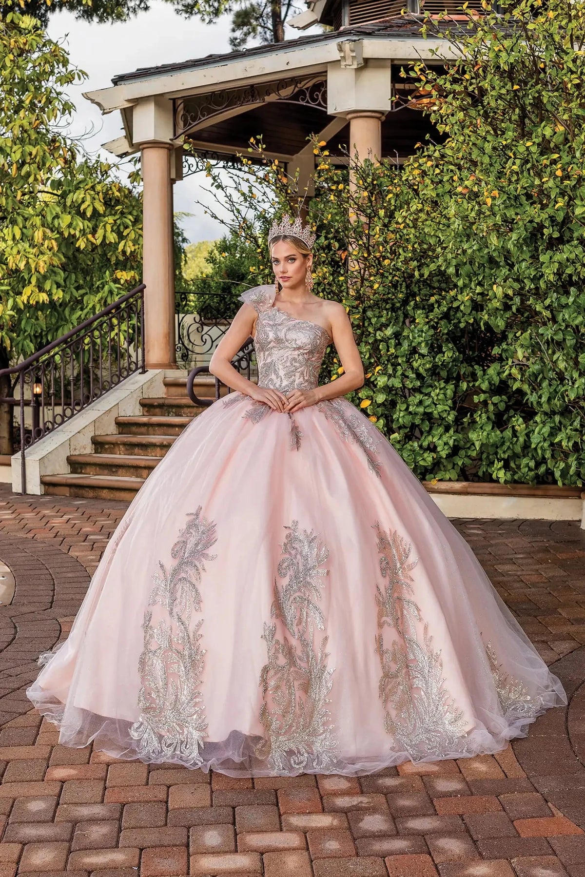 Front view of a Rose Gold quinceañera gown with one-shoulder neckline and embroidered tulle skirt