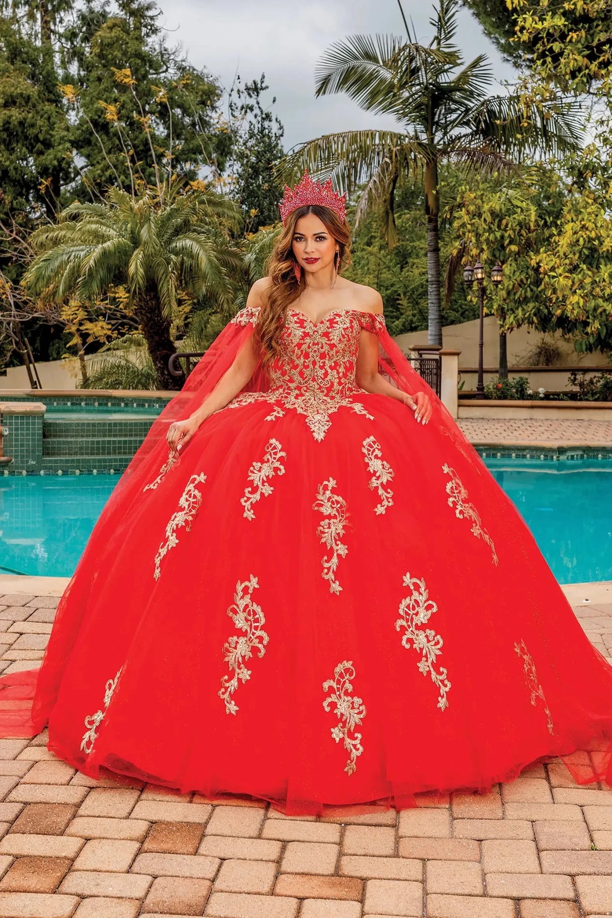 Front view of a Red quinceañera gown with off-the-shoulder neckline and floral embroidery