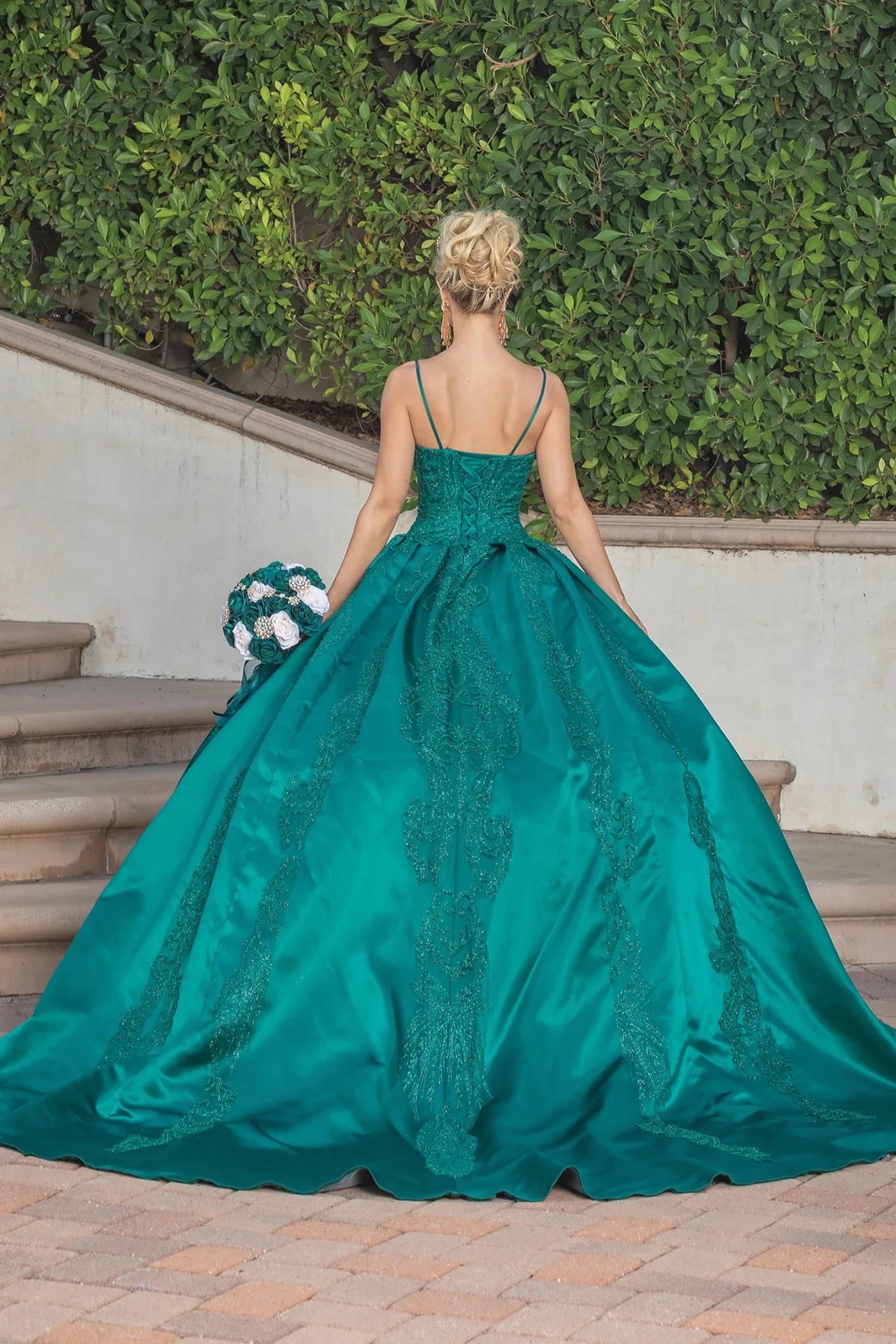 Back view of a Hunter Green quinceañera gown showing lace-up back and sweeping train