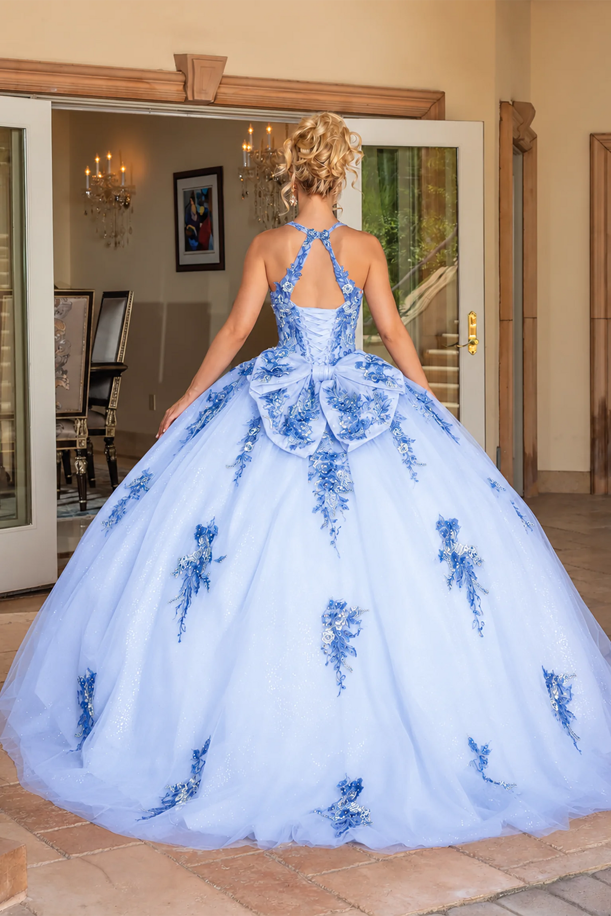 Blue floral appliqué quinceanera dress, back view with lace-up closure
