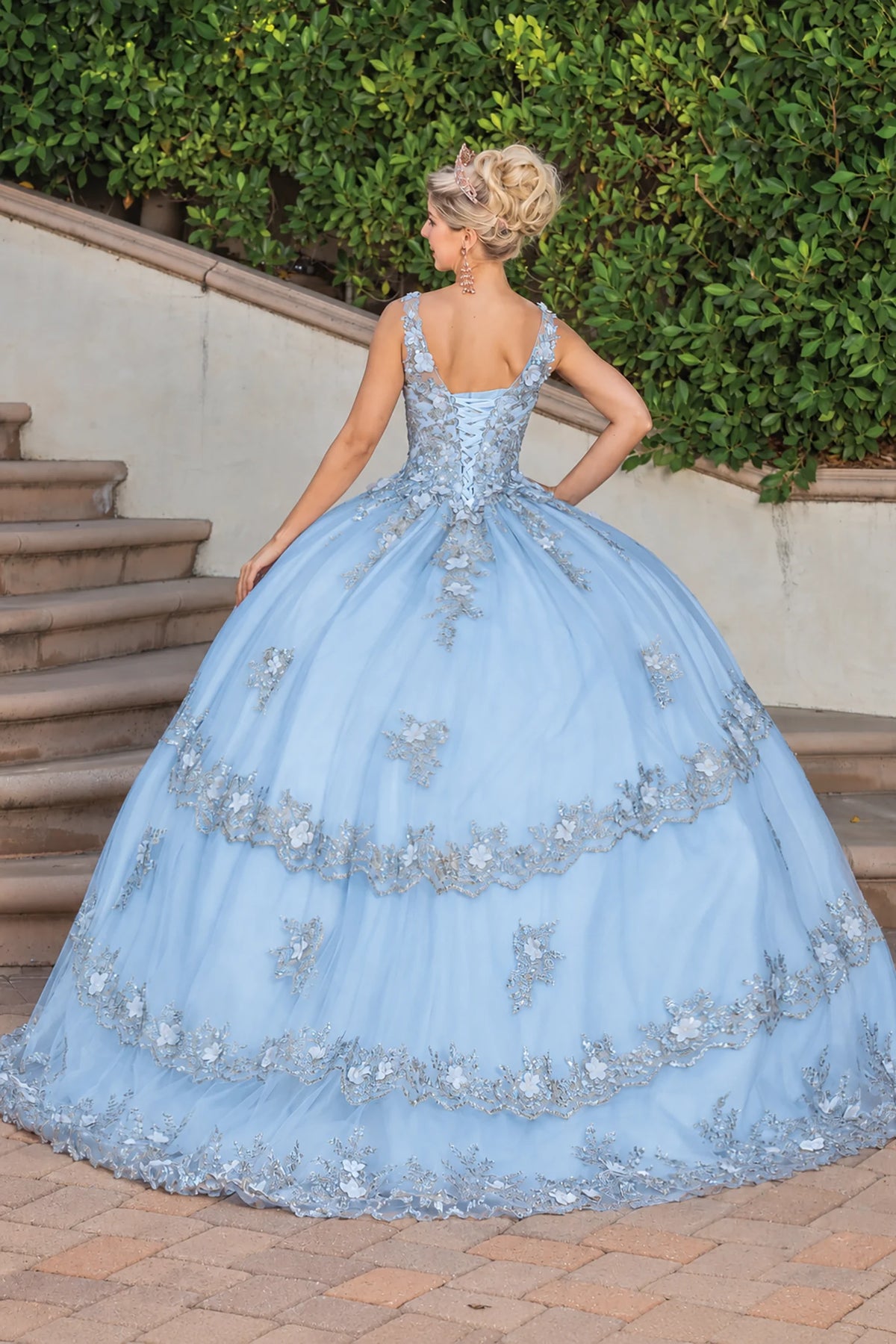 Blue floral appliqué quinceanera dress, back view with lace-up closure