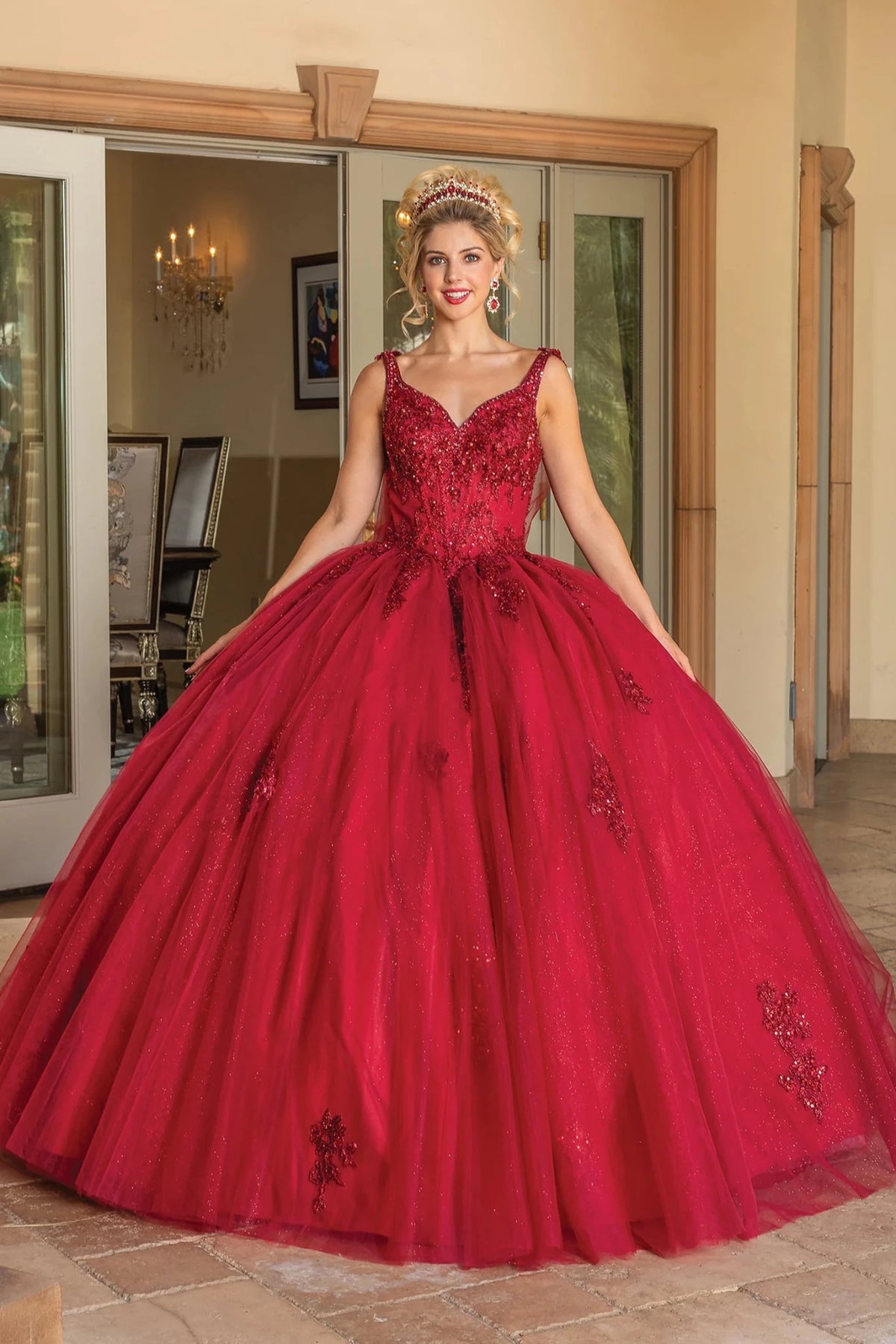 Front view of a Burgundy quinceañera gown with V-neckline, beaded bodice, and beaded embroidery