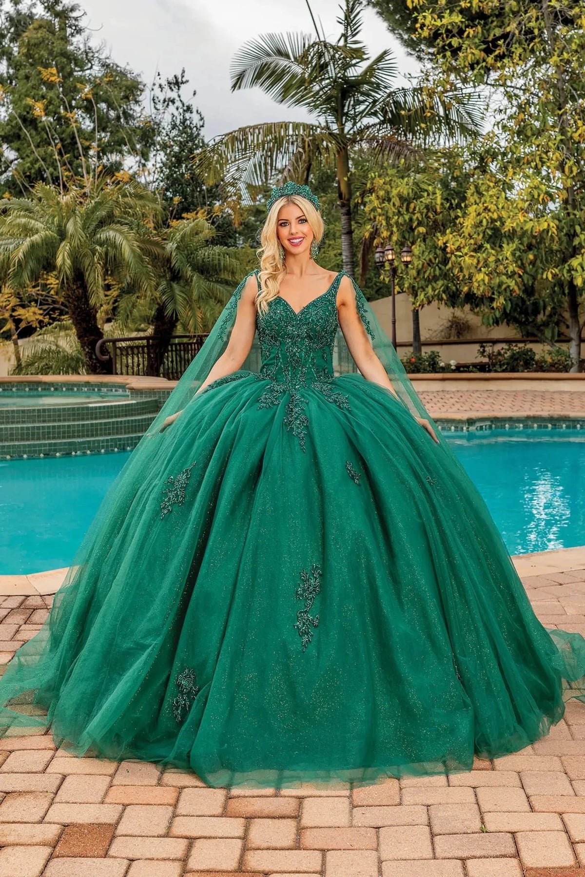 Front view of a Hunter Green quinceañera gown with V-neckline, beaded bodice, and beaded embroidery