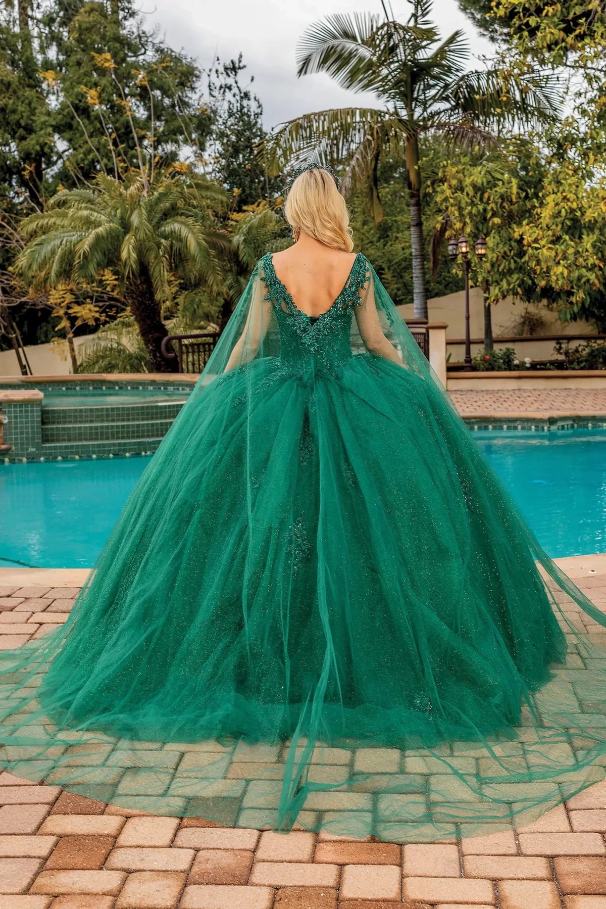 Back view of a Hunter Green quinceañera gown showing lace-up back and beaded embroidery