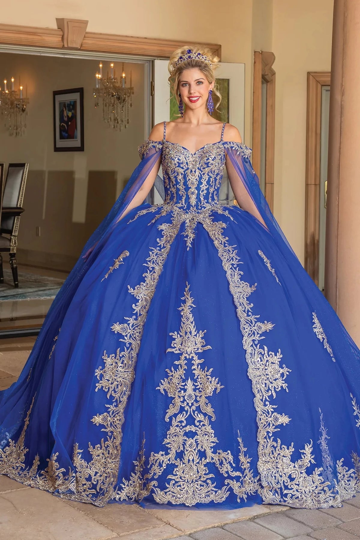 Front view of a Royal Blue quinceañera gown with off-the-shoulder neckline and crystal accents