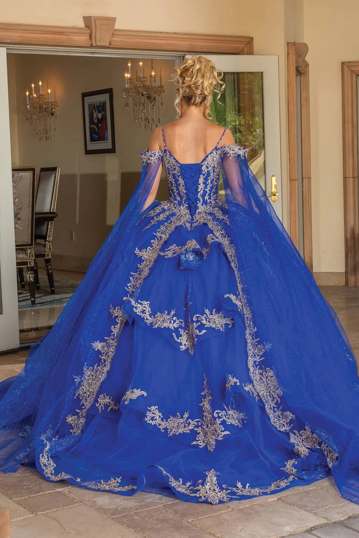 Back view of a Royal Blue quinceañera gown showing lace-up back and crystal accents