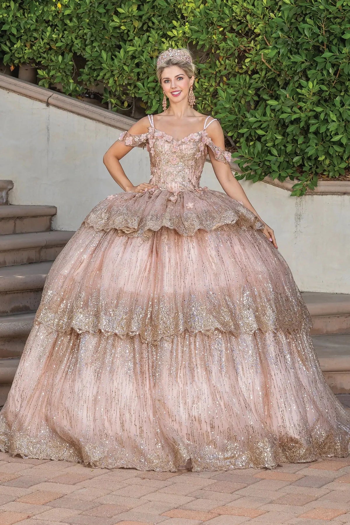 Front view of a Rose Gold quinceañera gown with cap sleeves and sequined tiered skirt