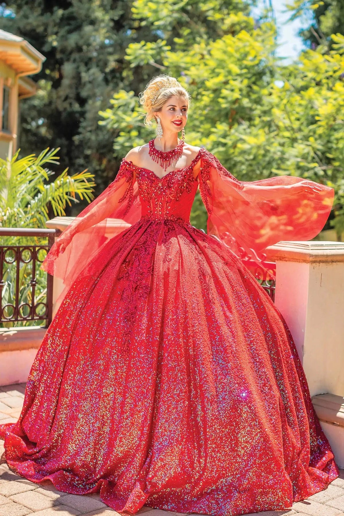 Front view of a Red quinceañera gown with scoop neckline and sequined lace
