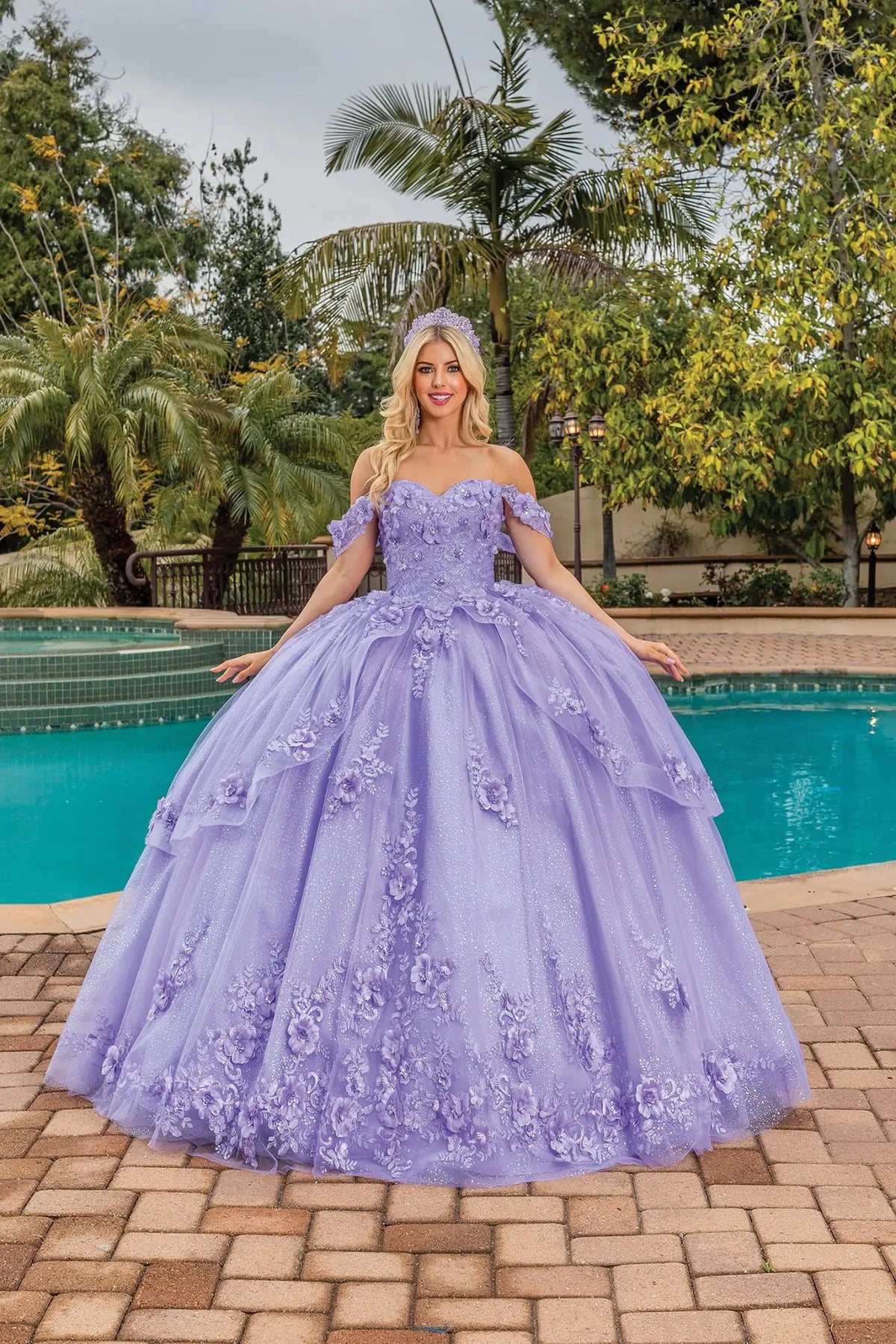 Front view of a Lilac quinceañera gown with sweetheart neckline and floral appliqués