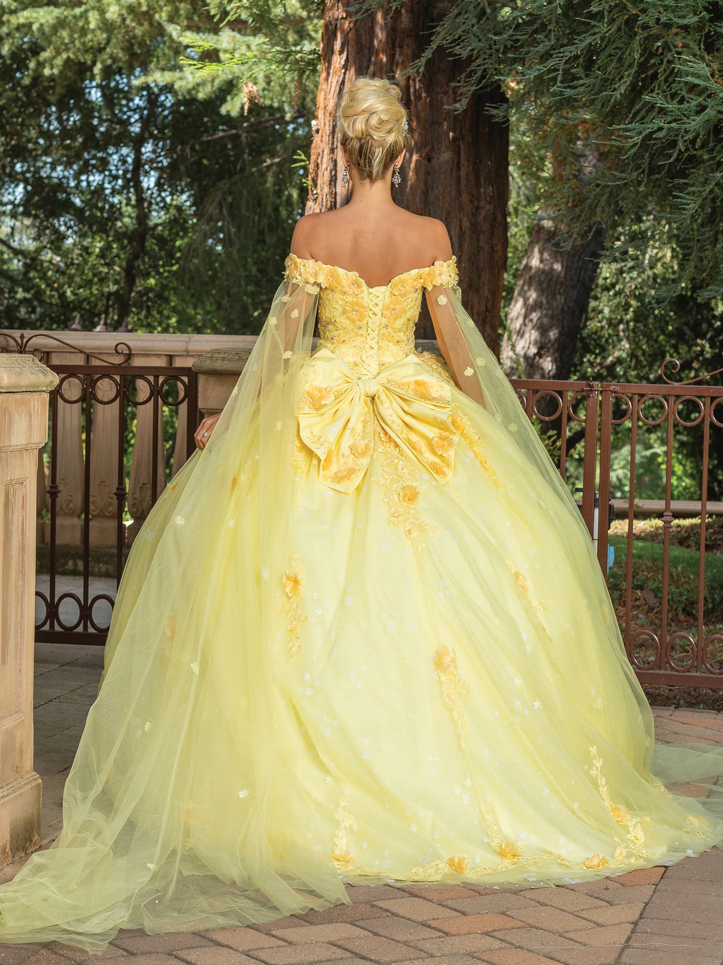 Yellow Fairytale Off-the-Shoulder Ball Gown with Embroidered Accents and Sheer Sleeved Cape Quince Dress - back view of woman wearing dress