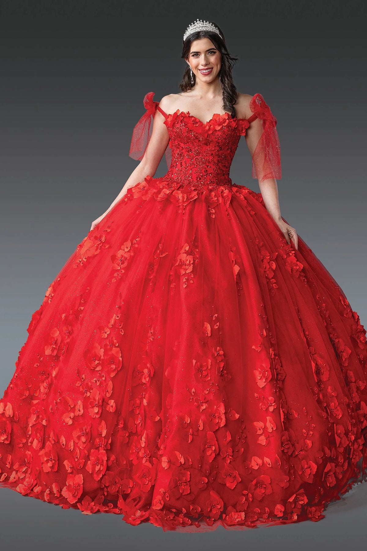 Front view of a Red quinceañera gown with off-the-shoulder neckline, corset bodice, and floral appliqués
